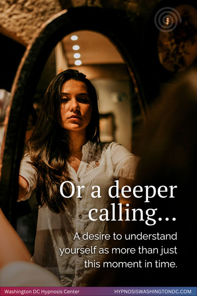 Woman gazing into mirror reflecting on deeper life purpose through past life regression hypnosis in Washington DCHypnosis Center self-discovery and past life regression