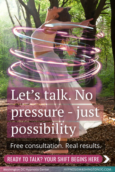Smiling woman in flowing dress surrounded by glowing light rings, symbolizing transformation and freedom with hypnosis – Washington DC Hypnosis Center free consultation