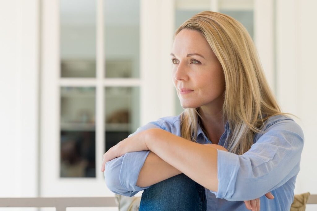 Woman in quiet reflection after a past life regression session Washington DC Hypnosis Center